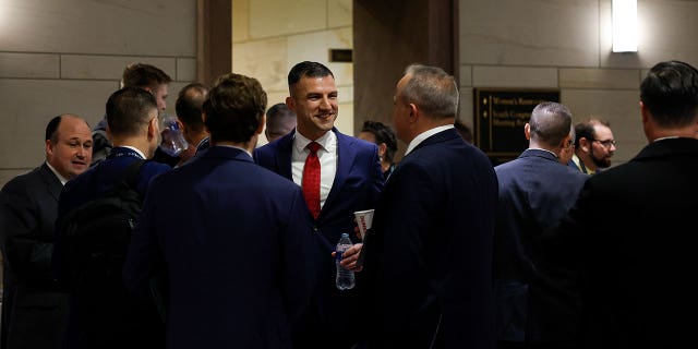 Rep.-Elect Rudy Yakym (R-IN) speaks with other newly elected lawmakers before going to an orientation meeting in the U.S. Capitol Building on November 14, 2022 in Washington, DC.