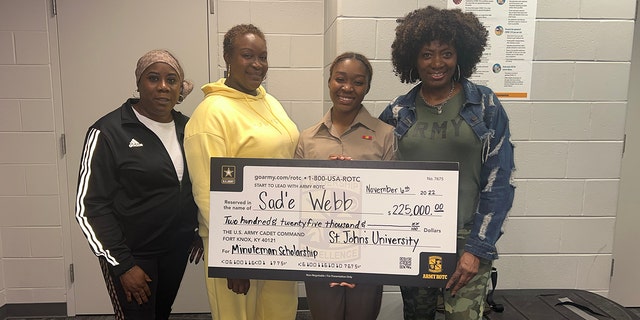 Seventeen-year-old Sad'e Webb and her family celebrate her U.S. Army Minuteman Scholarship to St. John's University at MetLife Stadium in New Jersey on Nov. 6, 2022.