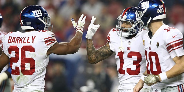 Odell Beckham (13) of the New York Giants celebrates with Saquon Barkley (26) after scoring a 20-yard touchdown against the San Francisco 49ers during a game at Levi's Stadium Nov. 12, 2018, in Santa Clara, Calif. 