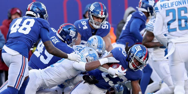 Gary Brightwell (23) of the New York Giants carries the ball against the Detroit Lions during the second quarter at MetLife Stadium on Nov. 20, 2022, in East Rutherford, New Jersey.