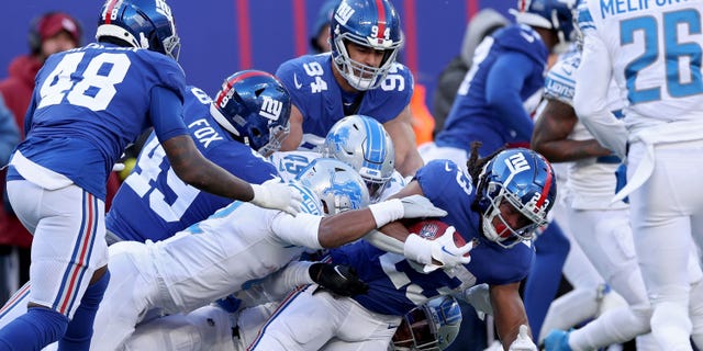 Gary Brightwell (23) of the New York Giants carries the ball against the Detroit Lions during the second quarter at MetLife Stadium on Nov. 20, 2022, in East Rutherford, New Jersey.