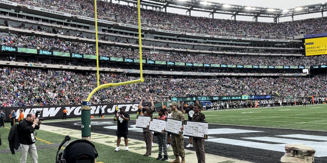 The four U.S. Army Minuteman Scholarship recipients claimed their prizes at the New York Jets Salute to Service game on Nov. 6, 2022.