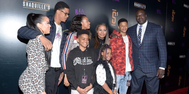 Shaunie O'Neal, left; NBA legend Shaquille O'Neal, right; and family attend the grand opening of Shaquille's at LA Live March 9, 2019, in Los Angeles.