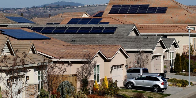 Solar panels are seen on the roofs of homes in Folsom, California, on February 12, 2020.