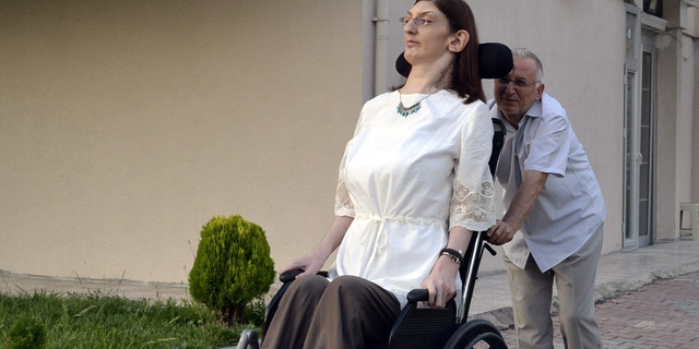 Rumeysa Gelgi who has a standing height of 213.6 cm (7ft 0.09 in) and who has been awarded the title of tallest teenager (female) in the world by Guinness World Records is now being awarded by the title of "The tallest female in the world under the age of 18" by the Assist World Records in Karabuk, Turkey on August 14, 2015. (Photo by Ersin Turan/Anadolu Agency/Getty Images)