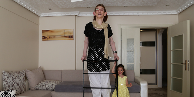 KARABUK, TURKEY - JULY 9: Rumeysa Gelgi, 17, granted as the world's tallest girl with her 2,13-meter height, poses at her home in Karabuk, Turkey on July 9, 2014. Gelgi, having Weaver syndrome, was named the world's tallest girl by Guinness Book of World Records. (Ibrahim Yozoglu/Anadolu Agency/Getty Images)