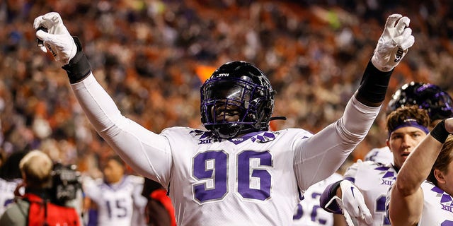Lwal Uguak #96 of the TCU Horned Frogs celebrates after defeating the Texas Longhorns at Darrell K Royal-Texas Memorial Stadium on November 12, 2022 in Austin, Texas. 