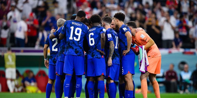 American players gather at half time during the FIFA World Cup Qatar 2022 Group B match against England at Al Bayt Stadium on November 25, 2022, in Al Khor, Qatar.