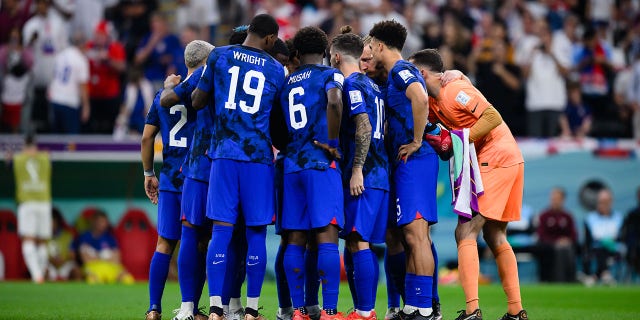 2022 fifa world cup USMNT players huddle at halftime during their FIFA World Cup Qatar 2022 Group B match against England at Al Bayt Stadium in Al Khor, Qatar, on Friday.