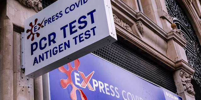 A sign for express PCR tests for Covid-19 is shown in London on July 11, 2022.