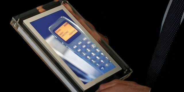The screen shows the first-ever SMS text in the world — sent on Dec. 3, 1992, to Richard Jarvis, one of the executives of British telecommunications operator Vodafone.