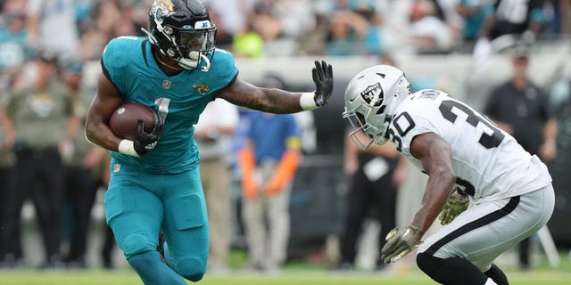 Jaguars blank Raiders in second half, come back to win at home 4 Travis Etienne Jr. (1) of the Jacksonville Jaguars rushes the ball against the Las Vegas Raiders during the second quarter at TIAA Bank Field on Nov. 6, 2022, in Jacksonville, Florida.