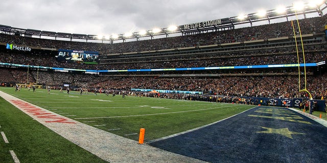 The opening kickoff and Met Life Stadium during the 122nd Army/Navy college football game between the Army Black Knights and the Navy Midshipmen on December 11, 2021, at MetLife Stadium in East Rutherford, NJ.