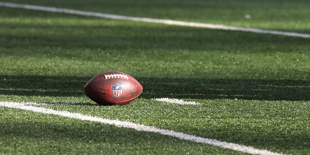 An NFL Football with the NFL crest on the field during the game between the Jacksonville Jaguars and The New York Jets at MetLife Stadium on December 26, 2021, in East Rutherford, New Jersey. 