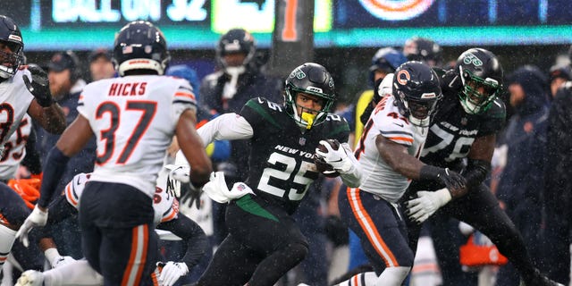 Ty Johnson of the New York Jets runs for yards against the Chicago Bears at MetLife Stadium on Nov. 27, 2022, in East Rutherford, New Jersey.