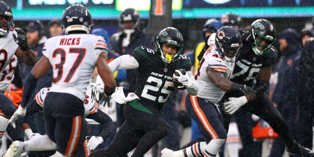Ty Johnson of the New York Jets runs for yards against the Chicago Bears at MetLife Stadium on November 27, 2022 in East Rutherford, New Jersey.