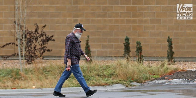 Latah County Prosecuting Attorney Bill Thompson is seen arriving at Moscow Police Station on Sunday, Nov. 27, 2022 as investigators continue to work on the shocking quadruple murder. 