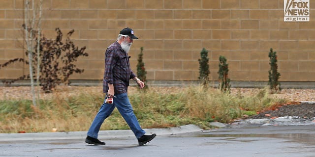 Latah County Prosecuting Attorney Bill Thompson is seen arriving at Moscow Police Station on Sunday, Nov. 27, 2022 as investigators continue to work on the shocking quadruple murder. 