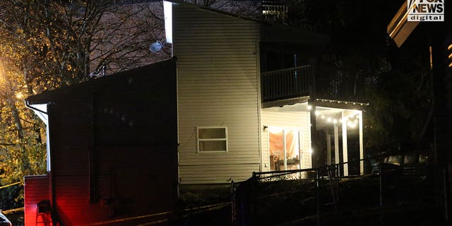 Exterior evening shot of the students' King Road rental home. Police say the suspect left through the read sliding door, visible on the right, after stabbing four undergrads on the home's second and third stories.