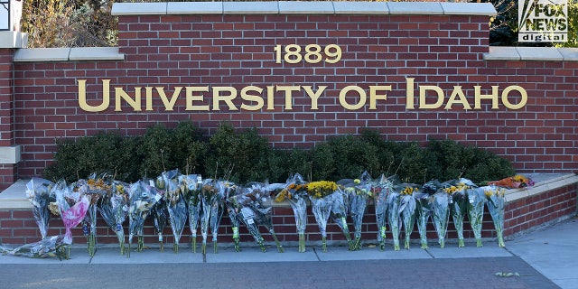 Flowers are displayed at an improvised memorial at the University of Idaho in Moscow, Idaho, Nov. 21, 2022, for four of its students who were slain on Nov. 13.