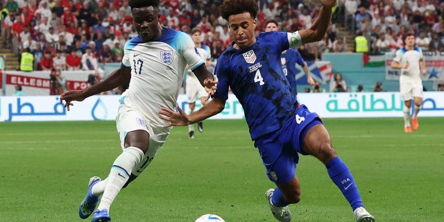 Bukayo Saka of England vies with Tyler Adams of the USA during their FIFA World Cup Qatar 2022 Group B match at Al Bayt Stadium in Al Khor, Qatar on Friday.