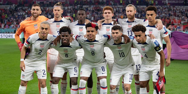 (Back row from LR) Matt Turner, Walker Zimmermann, Timothy Weah, Joshua Sargent, Tim Ream, Antonee Robinson, (front row from LR) Sergino Dest, Yunus Sargent, Weston McKennie, Christian Pulisic and Tyler Adams of USA line up for the team photo ahead of the FIFA World Cup Qatar 2022 Group B match between the USA and Wales at Ahmad Bin Ali Stadium on November 21, 2022, in Doha, Qatar.