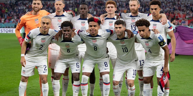 (Back row from LR) Matt Turner, Walker Zimmermann, Timothy Weah, Joshua Sargent, Tim Ream, Antonee Robinson, (front row from LR) Sergino Dest, Yunus Sargent, Weston McKennie, Christian Pulisic and Tyler Adams of USA line up for the team photo ahead of the FIFA World Cup Qatar 2022 Group B match between the USA and Wales at Ahmad Bin Ali Stadium on November 21, 2022, in Doha, Qatar.