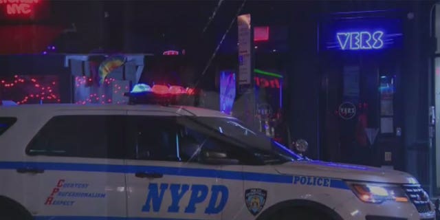 An NYPD cruiser in front of VERS gay bar in New York City. 