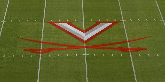 Virginia Cavaliers logo painted on field prior to a college football game between the Louisville Cardinals and the Virginia Cavaliers on October 08, 2022, at Scott Stadium in Charlottesville, VA.