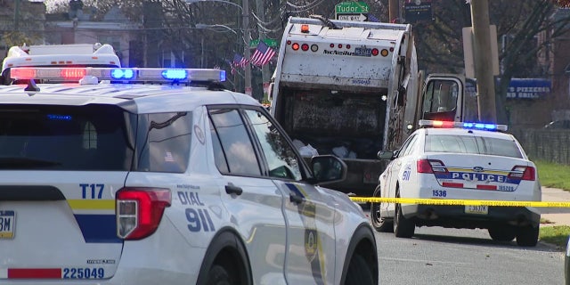 Philadelphia police blocked off the street where a city sanitation worker was killed Friday morning.
