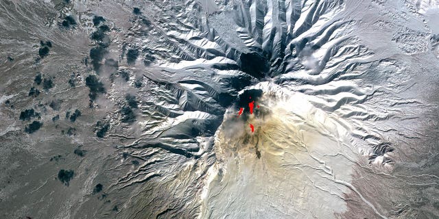 A satellite image of Shiveluch volcano in Kamchatka, Siberia, Russia, on March 26, 2010. 