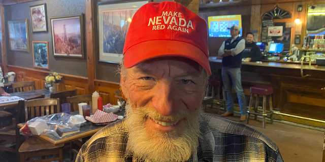 Nevada voter Randall Clark wears a hat that reads "Make Nevada red again." Clark attended a small rally on Nov. 2 in Eureka, Nev., one of the stops on Laxalt's bus tour.
