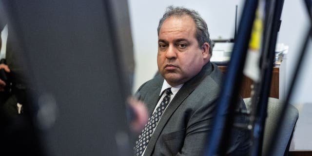 Defendant Bahram Hojreh listens to opening statements during his trial in Orange County Superior Court in Santa Ana, CA