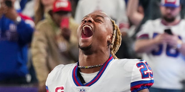 Xavier McKinney of the New York Giants runs out during introductions against the Dallas Cowboys at MetLife Stadium Sept. 26, 2022, in East Rutherford, N.J.