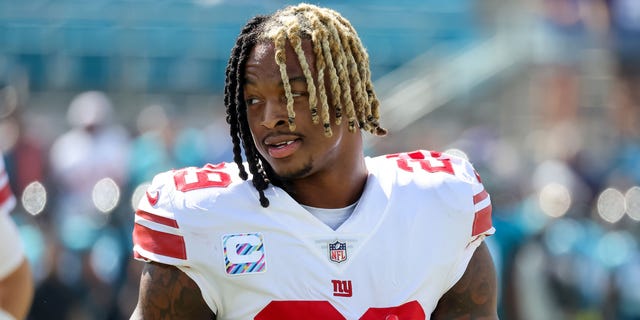 Xavier McKinney of the New York Giants warms up against the Jacksonville Jaguars at TIAA Bank Field Oct. 23, 2022, in Jacksonville, Fla.