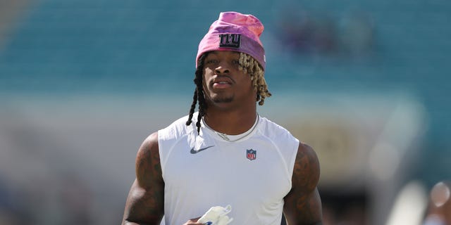 Xavier McKinney of the New York Giants warms up before a game against the Jacksonville Jaguars at TIAA Bank Field Oct. 23, 2022, in Jacksonville, Fla.