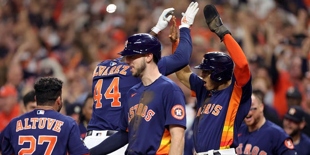 Yordan Alvarez #44 of the Houston Astros celebrates his three-run home run against the Philadelphia Phillies with teammate Jeremy Pena #3 of the Houston Astros during the sixth inning in Game Six of the 2022 World Series at Minute Maid Park on November 05, 2022 in Houston, Texas. 