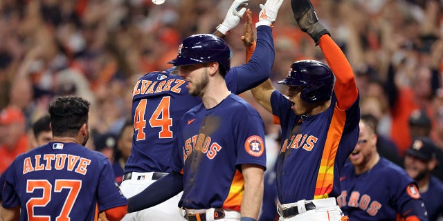 Yordan Alvarez #44 of the Houston Astros celebrates his three-run home run against the Philadelphia Phillies with teammate Jeremy Pena #3 of the Houston Astros during the sixth inning in Game Six of the 2022 World Series at Minute Maid Park on November 05, 2022 in Houston, Texas. 