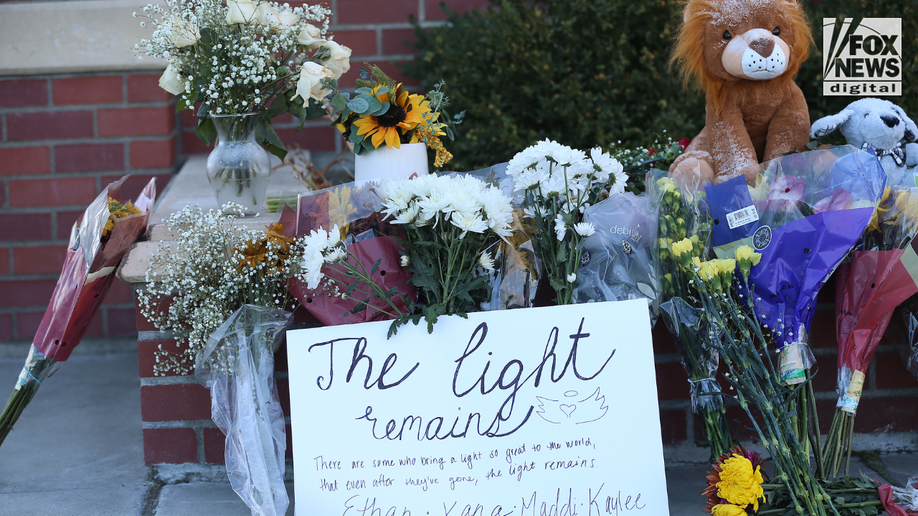 Flowers sign University Idaho memorial