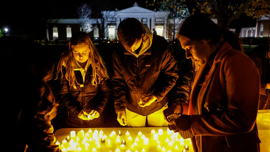 UVA students leave candles at vigil