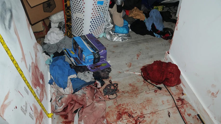 A blood-smeared floor and clothes.