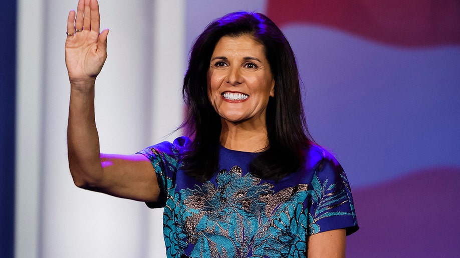 Nikki Haley holding her hand in the air