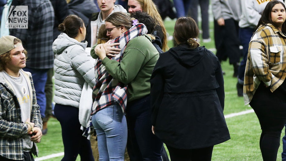 Mourners at Idaho vigil embracing