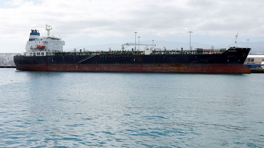 Photo from a distance showing the entire Alithini oil tanker during daytime