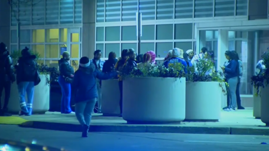 People waiting outside hospital