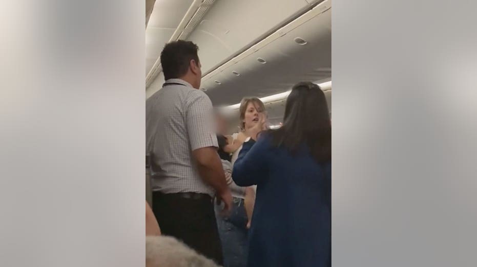 United plane turns back 3 hours into flight after a 'disruptive' passenger  sat in a crew seat and got in a shouting match with a flight attendant,  report says