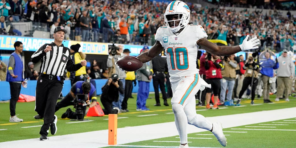 Tyreek snags game-winner as Dolphins outlast Chargers. See photos