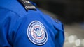 A Transportation Security Administration (TSA) agent's patch is seen as she helps travelers place their bags through the 3-D scanner at the Miami International Airport on May 21, 2019 in Miami, Florida. TSA has begun using the new 3-D computed tomography (CT) scanner in a checkpoint lane to detect explosives and other prohibited items that may be inside carry-on bags. - Fox News