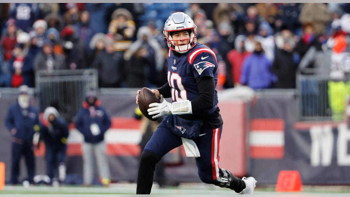 Mac Jones throws a pass