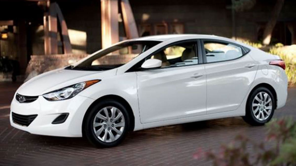 White hyundai sedan parked stock image